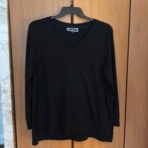 Soft sweater-like material, shirt size 1x.